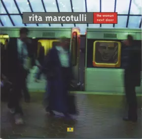 Couverture du produit · The Woman Next Door