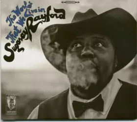 Couverture du produit · The World That We Live In